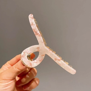 Pink marble acetate hair claw clip with bead details for thick hair styling