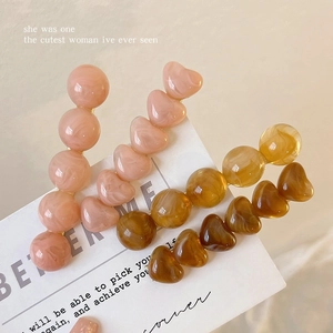 Jelly texture heart and bead hair clips in coral and amber marble resin finishes