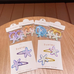 Colorful starfish hair clips and ties set with sparkling sequins for young girls