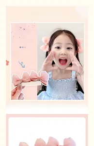 Detail of pink chiffon layered bow hair clips for girls showing texture and metal clip