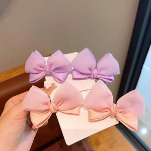 Set of four Korean style 3D organza bow hair clips in purple and peach pink colors