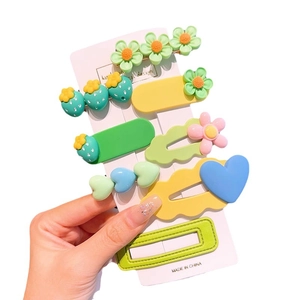 Set of 10 colorful candy-style hair clips featuring flowers and hearts for girls