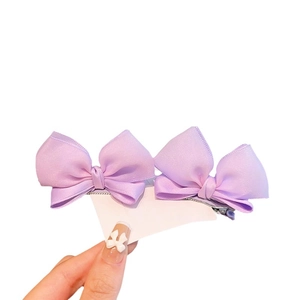 Set of two purple satin double-layered bow hair clips for girls on display card