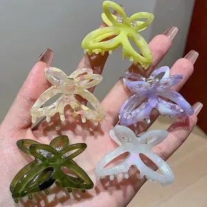 Elegant butterfly hair claws in various marble colors for French style updos