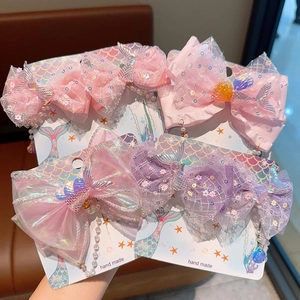 Détails de quatre barrettes nœuds sirène faits main avec perles et pompons pour filles