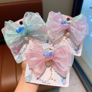 Lot de trois barrettes nœuds sirène colorées avec glands en perles pour fillettes