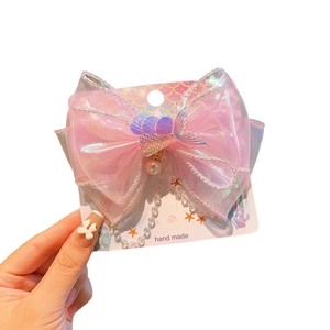 Barrette sirène en résille laser rose avec nœud, gland perlé et queue de poisson