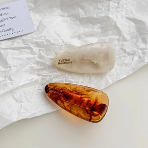 Water-drop acetate hair clips in marble white and tortoise shell finish for women