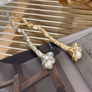 Vintage metal flower hair pins with pearls and textured branch design in gold and silver