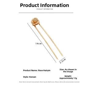 Detail view of a 14cm golden rose hair pin with measurements and metal texture