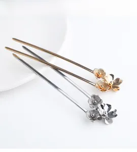 Detailed view of three metal floral hair pins in gold and silver for Chinese updos