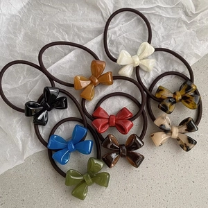 Set of colorful resin bow hair ties with high elastic bands for stylish ponytails