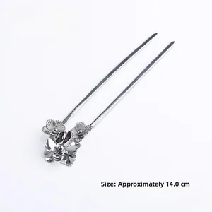 Detailed view of silver flower hairpin showing 14cm length and double-prong design