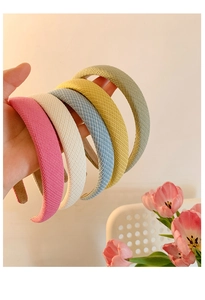 Detailed knit texture of multi-colored sponge headbands with soft velvet inner lining