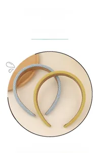 Detail of yellow and blue sponge headbands with a textured woven fabric pattern