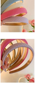 Close-up of woven fabric headbands in pink and blue with non-slip velvet lining