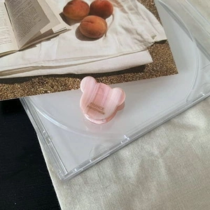 Detailed macro view of pink acetate bear hair clip featuring France Handmade gold lettering