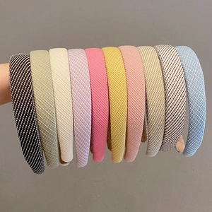 Detail shot of multi-color padded sponge headbands with diamond grid texture fabric