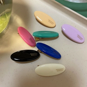 Détails de barrettes ovales colorées en résine avec inscription dorée France Handmade