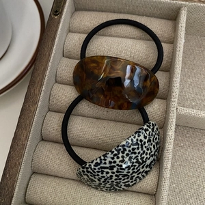 Set of two elegant acetate hair ties with amber tortoise and dalmatian pattern accents