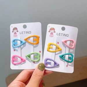 Close-up of colorful heart-shaped matte hair clips for girls on display cards