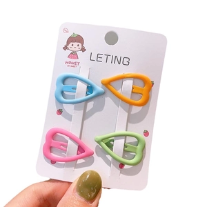 Set of 4 matte colorful heart-shaped hair clips on decorative display card