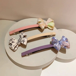 Three-piece set of elegant acetate bow hair clips with marble texture and spring fasteners