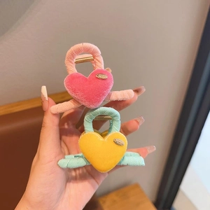 Plush heart hair claws for girls in pink and blue velvet featuring handmade metal plates