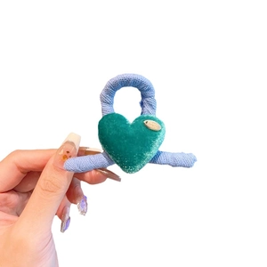 Plush purple velvet heart hair claw clip for girls featuring elegant green velvet heart detail