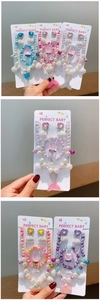 Detailed set showing mermaid shell pendants and pearl beads for girl's jewelry sets