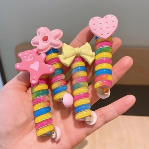 Set of 4 candy-colored spiral hair ties featuring cute cartoon bear and flower designs