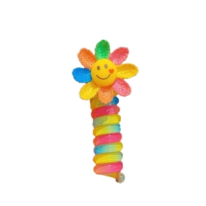 Colorful sunflower spiral hair tie with smiley face design and rainbow telephone cord