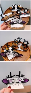 Detail showing various Halloween clips including black antlers and glittery pumpkin elements