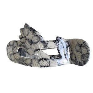 Irregular marble patterned acetate hair claw clip with black and white streaks and glossy finish