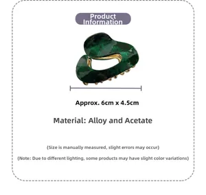 Detail view of iridescent marble acetate hair claw clip with alloy base showing 6x4.5cm size