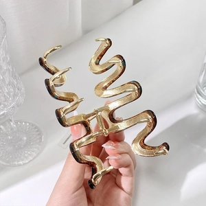 Pince à cheveux ondulée en métal avec motif ambre et étiquette faite à la main en doré