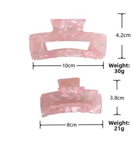 Pink marble acetate hair claw clips in large and small sizes with detailed dimensions