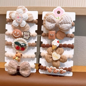 Detail view of 10-piece cute floral hair ties in coffee tones for girls on display cards