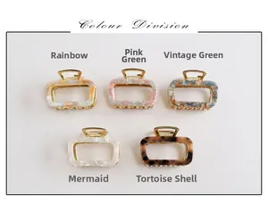 Detail of five square hollow acetate hair claws in various vintage marble colors