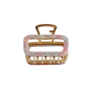 Square hollow acetate hair claw clip with pink marble pattern and gold metal frame