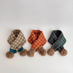 Cozy knit winter scarves for kids with floral patterns and soft faux fur pom-poms