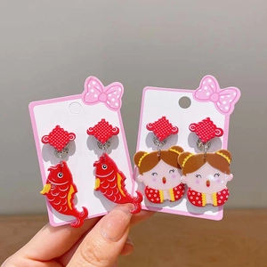 Children New Year ear clips with cartoon koi and girl motifs in festive red color