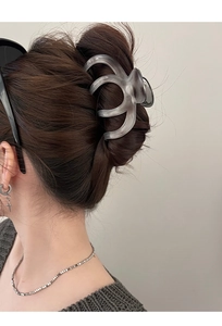 Elegant matte grey acetate shark hair claw clip for women in a modern minimalist style