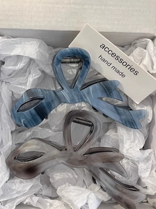 Elegant marbled acetate hair claws in blue and grey with irregular bow design