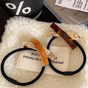 Premium acetate and metal hair ties with amber and tortoiseshell geometric patterns