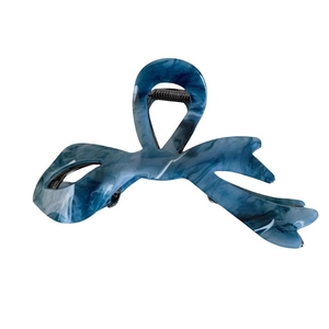 Elegant blue acetate butterfly hair claw clip with a stylish marble texture and metal spring