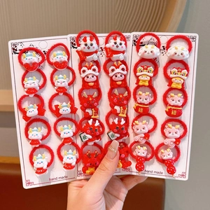Detailed view of red high-elastic hair ties with cute cartoon resin zodiac dragon charms