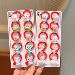Detailed set of 20 kids red hair ties with various cute cartoon dragon resin charms