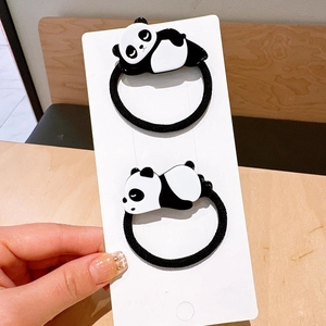 Close-up of cute cartoon panda hair ties with high elastic black braided bands