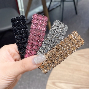 Set aus vier Strass-Haarspangen in Schwarz, Violett, Klar und Bernstein im Rechteck-Design